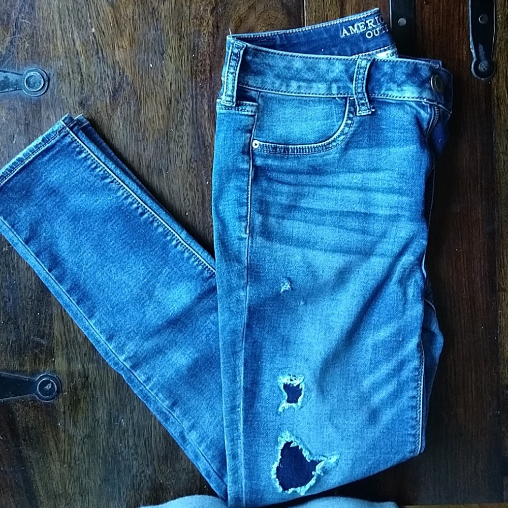 Distressed jegging with holes patched